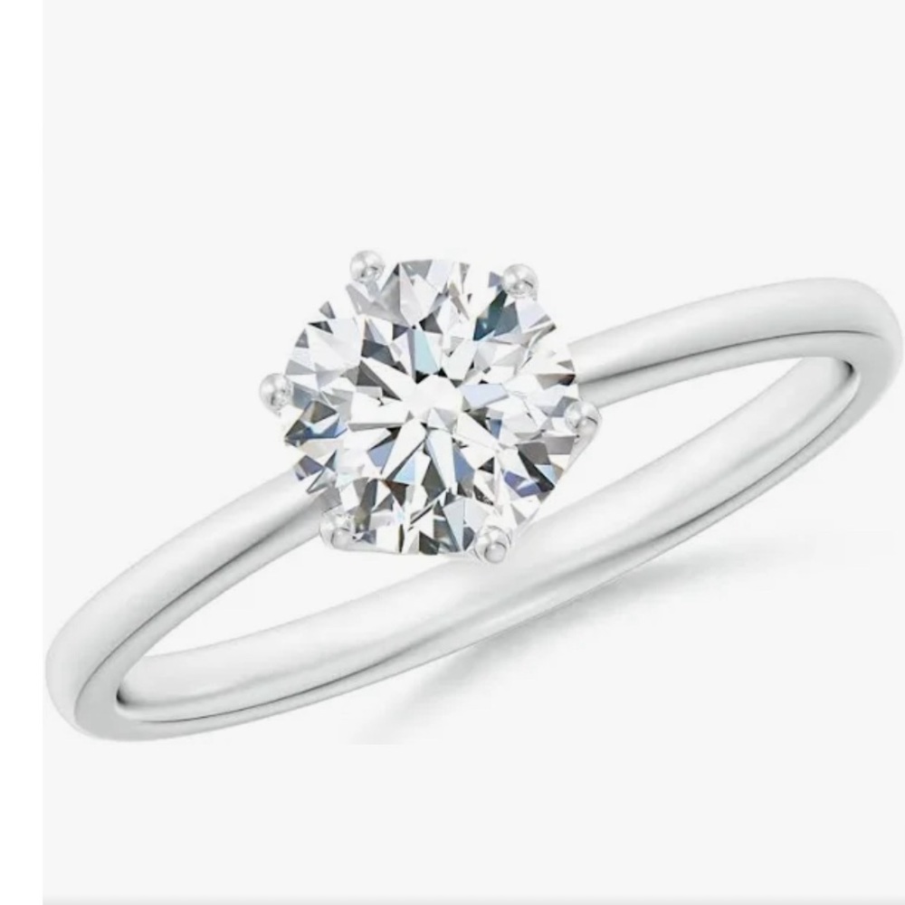 Size 6 platinum and diamond solitaire. Never worn.